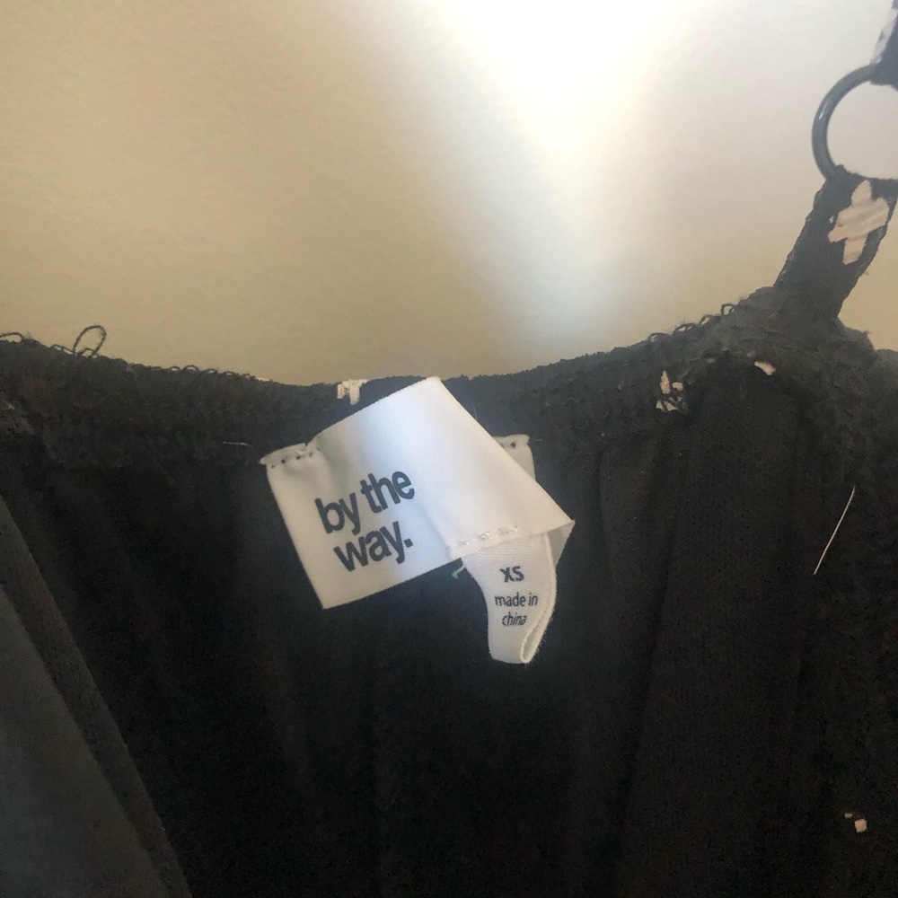 Revolve by the way. Aurora Ruffle Romper in Black - Picture 6 of 7
